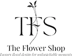 Logo The Flower Shop : Élégance Florale et Design Graphique Logo noir et blanc 'TFS' stylisé avec une tige florale, sous le texte 'The Flower Shop' et un sous-titre illisible.